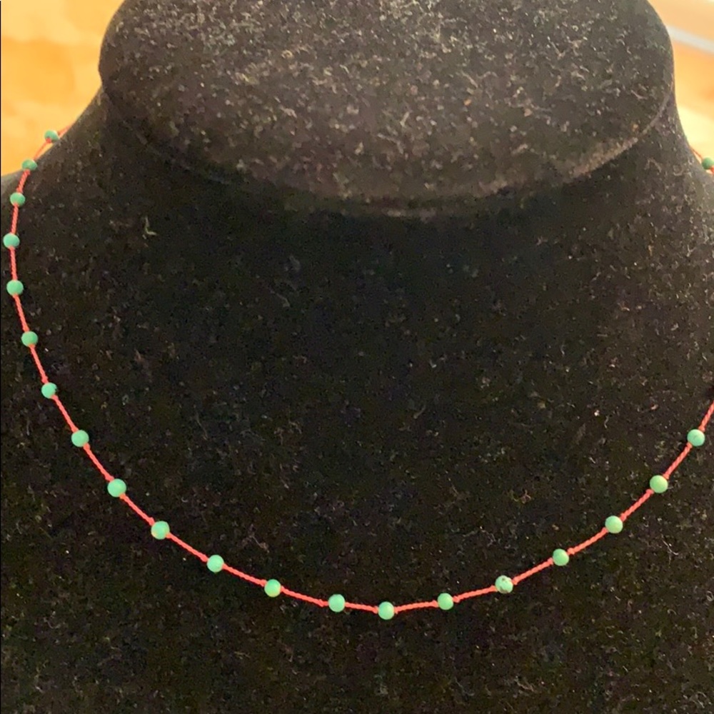 Turquoise beads and a red string necklace